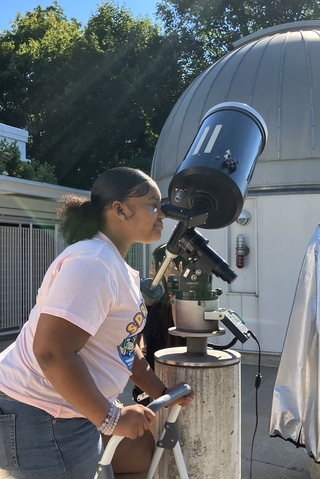 2024 YASSE participant observing the Sun with solar filter